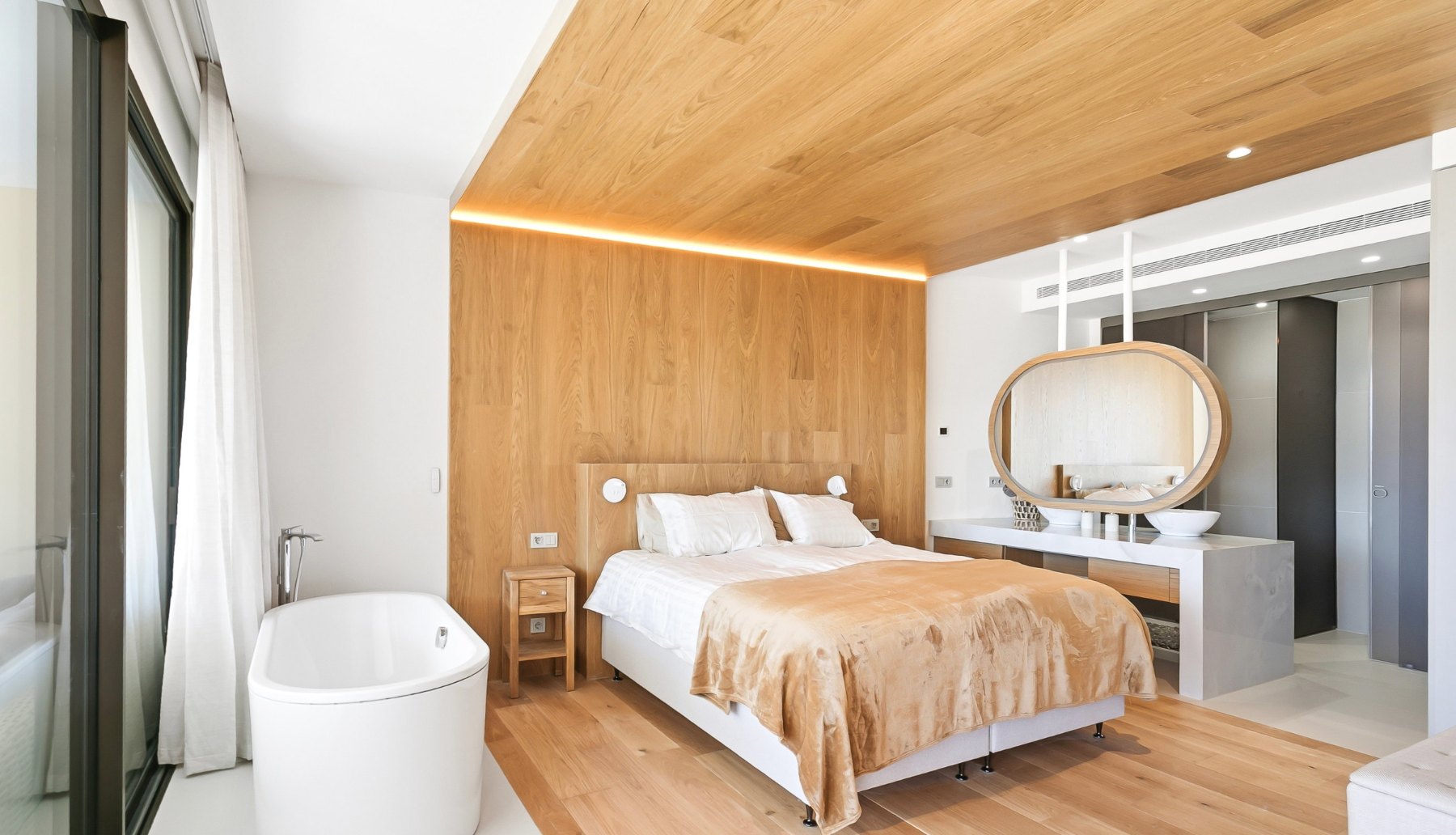 Bedroom with a wooden ceiling and freestanding bath, ready for arrival